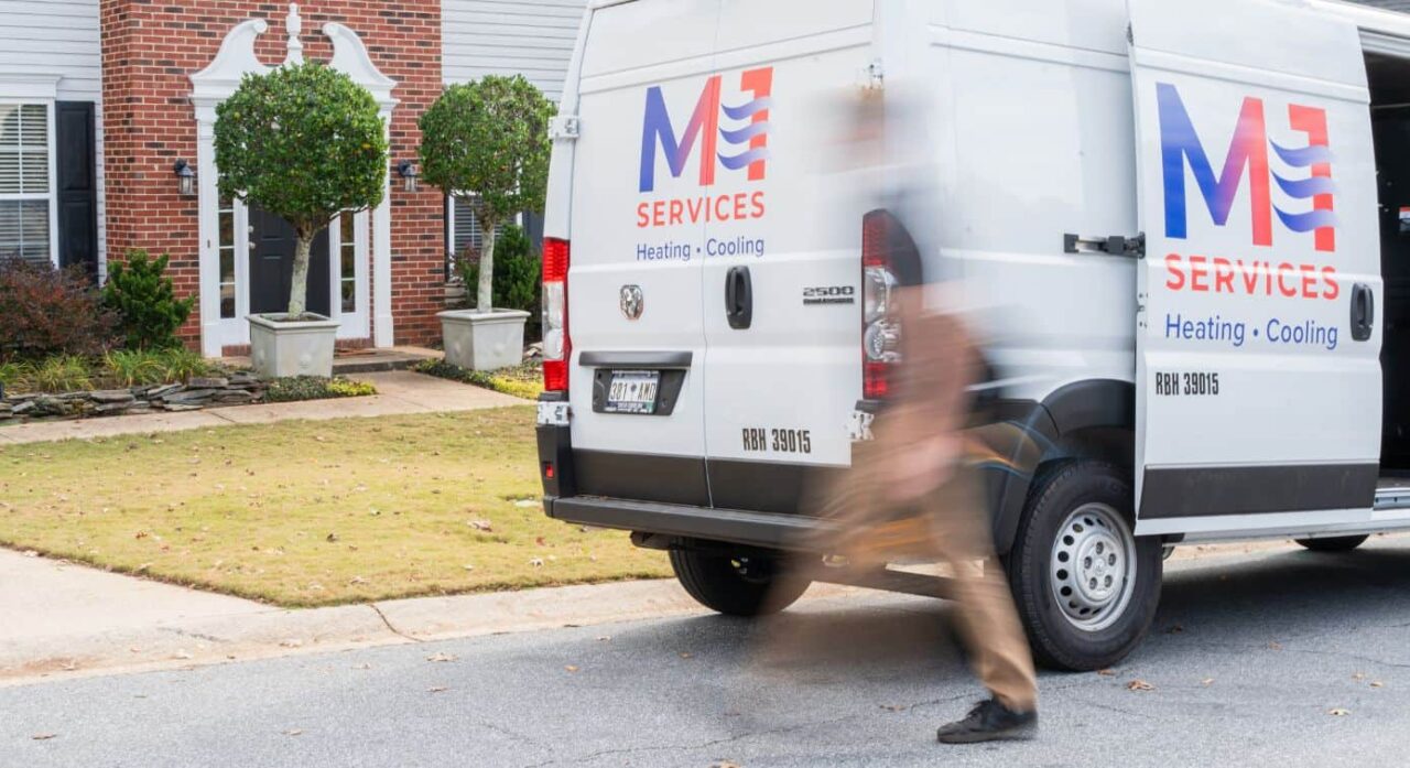 M1 Services HVAC van parked outside a home in Upstate South Carolina, highlighting your trusted HVAC partner.
